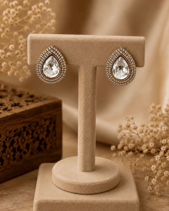 Aurelle teardrop stud earrings: gold-tone teardrop with clear crystal halo