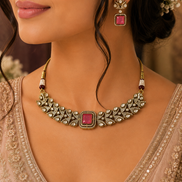 Ruby-pink square-stone choker necklace with ornate gold detailing and stud drop earrings.