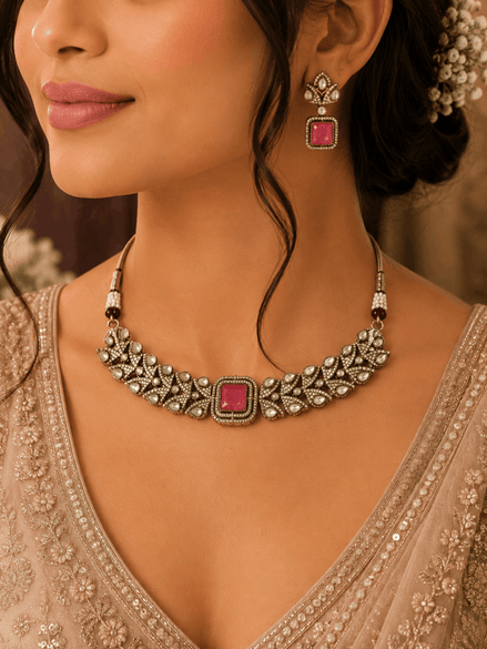 Ruby-pink square-stone choker necklace with ornate gold detailing and stud drop earrings.