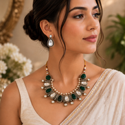 Mahira Heritage necklace set with green cabochons and pearls, matching teardrop earrings.