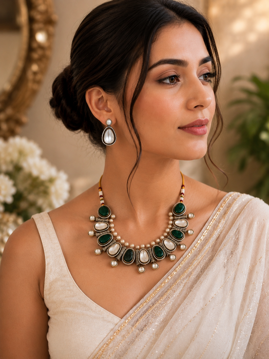 Mahira Heritage necklace set with green cabochons and pearls, matching teardrop earrings.