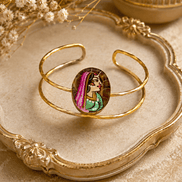 Gold-tone oval enamel face cuff bracelet on decorative base