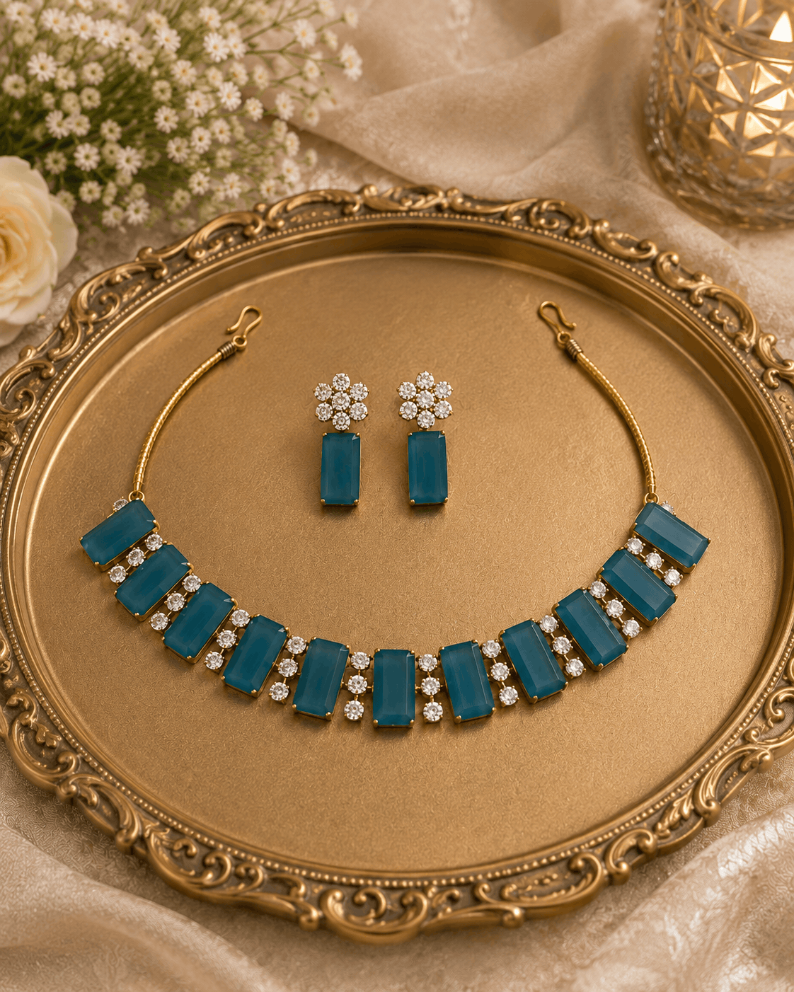 Teal blue gemstone choker and matching drop earrings with gold-tone settings