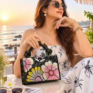 Elara floral bag: black beaded handbag with pink and yellow flower embroidery