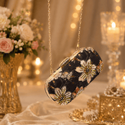 Black embellished floral clutch bag with gold beaded chain shoulder strap.