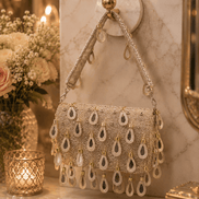Beige beaded shoulder bag with teardrop drops and chain shoulder straps, front view