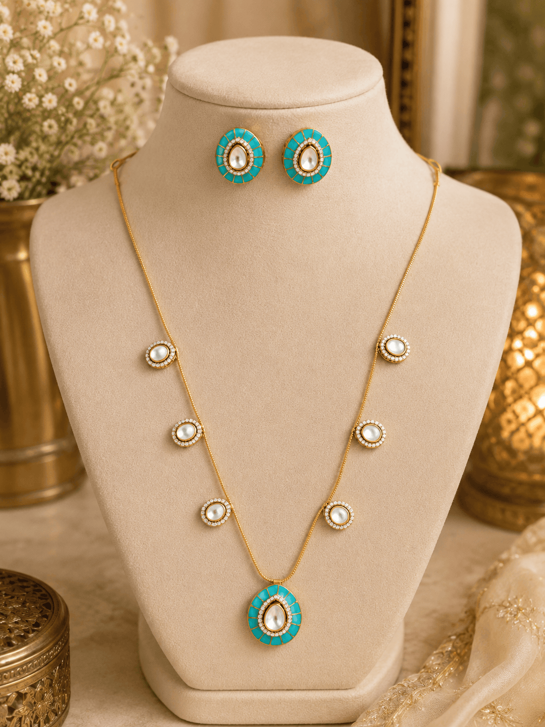 Gold-tone necklace with turquoise center pendant and matching stud earrings