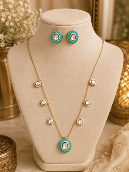 Gold-tone necklace with turquoise center pendant and matching stud earrings