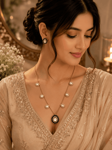 Gold-tone necklace with turquoise center pendant and matching stud earrings worn with dress