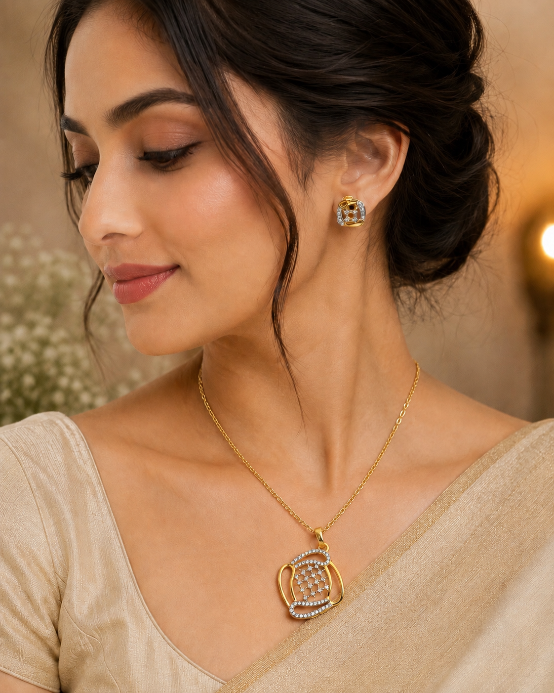 Gold-tone teardrop pendant necklace with blue crystal stud earrings on model