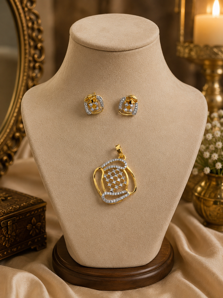 Gold-tone pendant necklace with blue crystal stud earrings on display bust
