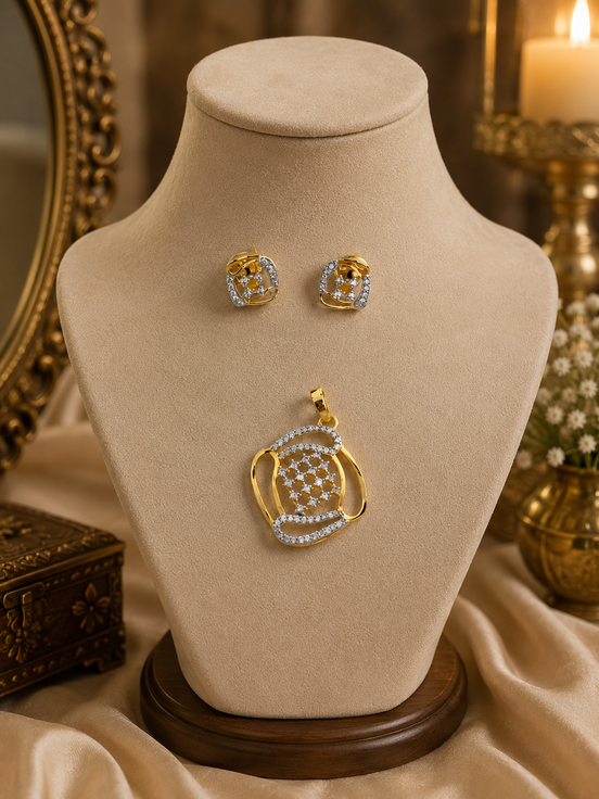 Gold-tone pendant necklace with blue crystal stud earrings on display bust