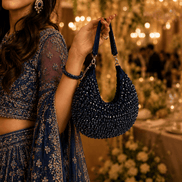 Navy blue beaded hobo bag with dangling beaded handles