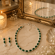 Emerald-green beaded necklace with matching drop earrings and silver-tone chain