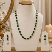 Emerald-green beaded necklace with matching drop earrings, silver-tone accents