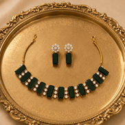 Emerald green gemstone choker and matching drop earrings with gold-tone settings