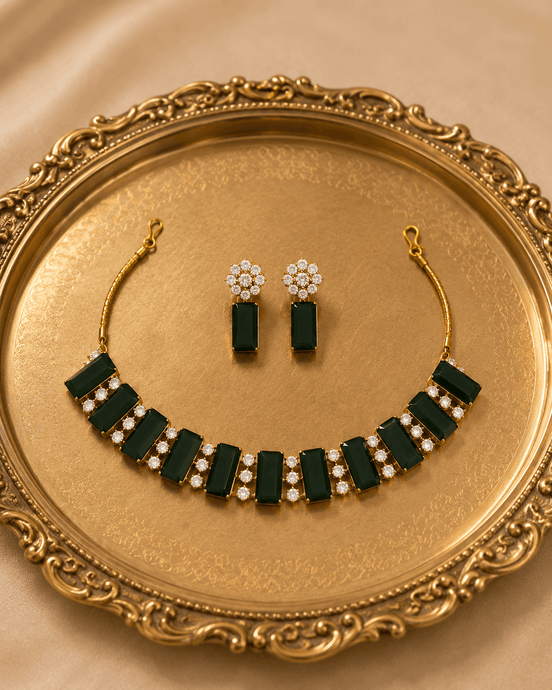 Emerald green gemstone choker and matching drop earrings with gold-tone settings