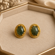 Oval teal stone stud earrings with gold-tone ridged bezel