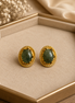 Oval teal stone stud earrings with gold-tone ridged bezel