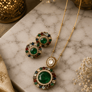 Gold-tone pendant necklace set with round stud earrings and green center circular pendant