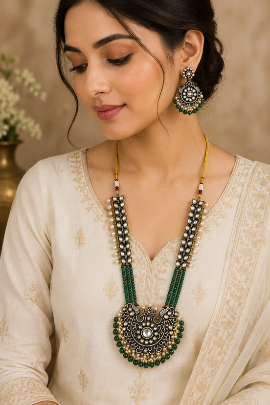 Gold-tone long necklace set with green-and-yellow beaded strands, ornate pendant, earrings