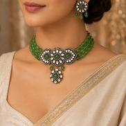 Green beaded floral choker with teardrop pendant and matching oval dangle earrings