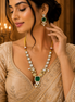 Gold-toned necklace and earrings set with teal square center and pearl drops