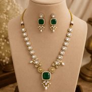 Gold-toned necklace set with teal square center pendant and dangling pearl earrings