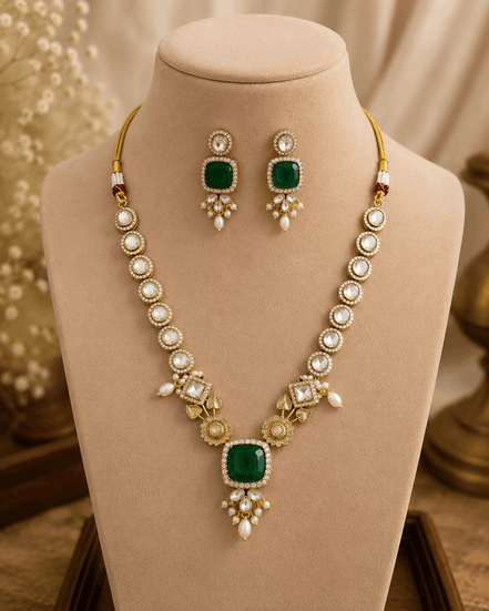 Gold-toned necklace set with teal square center pendant and dangling pearl earrings