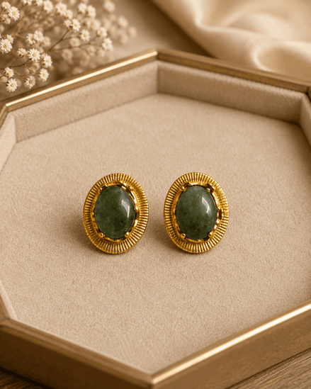 Oval teal stone stud earrings with gold-tone ridged bezel