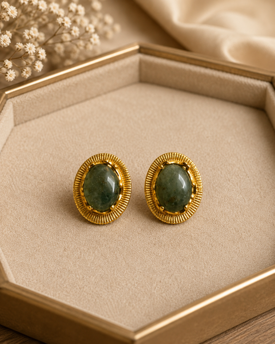 Oval teal stone stud earrings with gold-tone ridged bezel