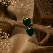 Dark green teardrop stud earrings with faceted stones