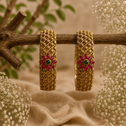 Antique gold wide bangles with pink & green floral center stones, textured lattice