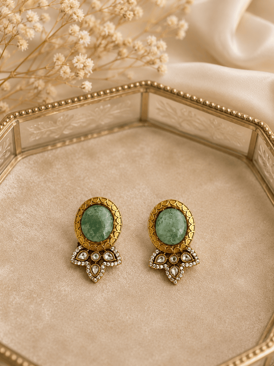 Green oval stud earrings with gold bezel and crystal teardrop chandelier charms