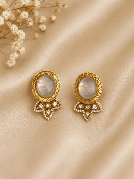 Gray oval stud earrings with gold halo and crystal heart-shaped drops