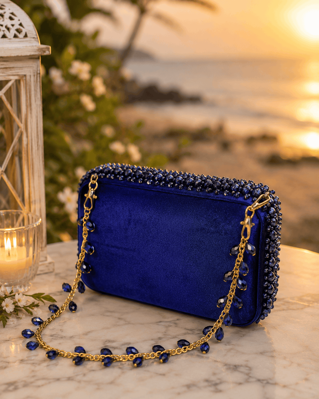 Blue beaded mini bag with gold chain shoulder strap and bead trim border