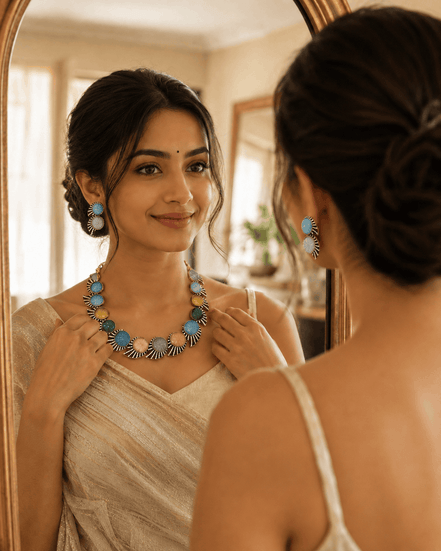 Multicolor beaded stone necklace and matching drop earrings on a model