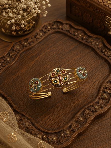 Enamel cuff bracelet with gold-tone frame and multicolor peacock centerpiece