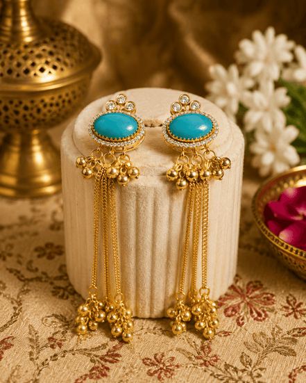 Gold tassel earrings with oval teal stones, rhinestone halo, and dangling beaded drops