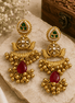 Gold kundan pearl-style jhumka earrings with green and red teardrop stones