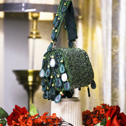 Teal beaded hobo bag with dangling teardrop charms and short top handles