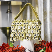 Beige beaded hobo bag with dangling teardrop charms and long top handle