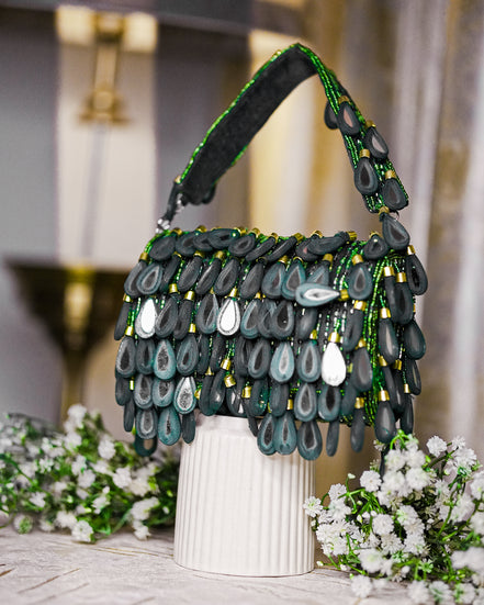 Teal green beaded hobo bag with teardrop bead fringe and short top handles