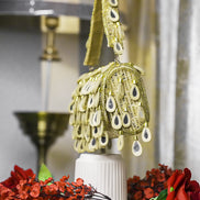 Lime gold beaded hobo bag with round teardrop charm cluster and top handle