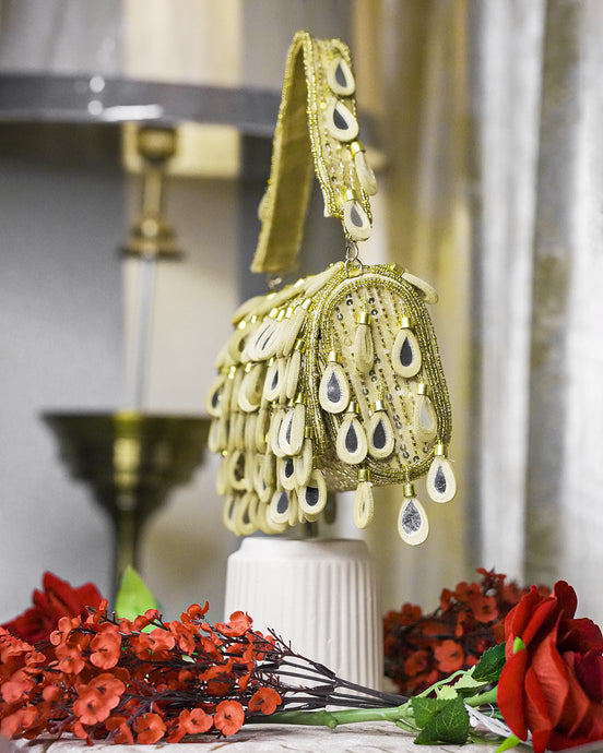 Lime gold beaded hobo bag with round teardrop charm cluster and top handle