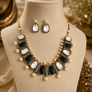 Mahira Heritage necklace set with black and white oval stones, pearl drops, stud earrings.