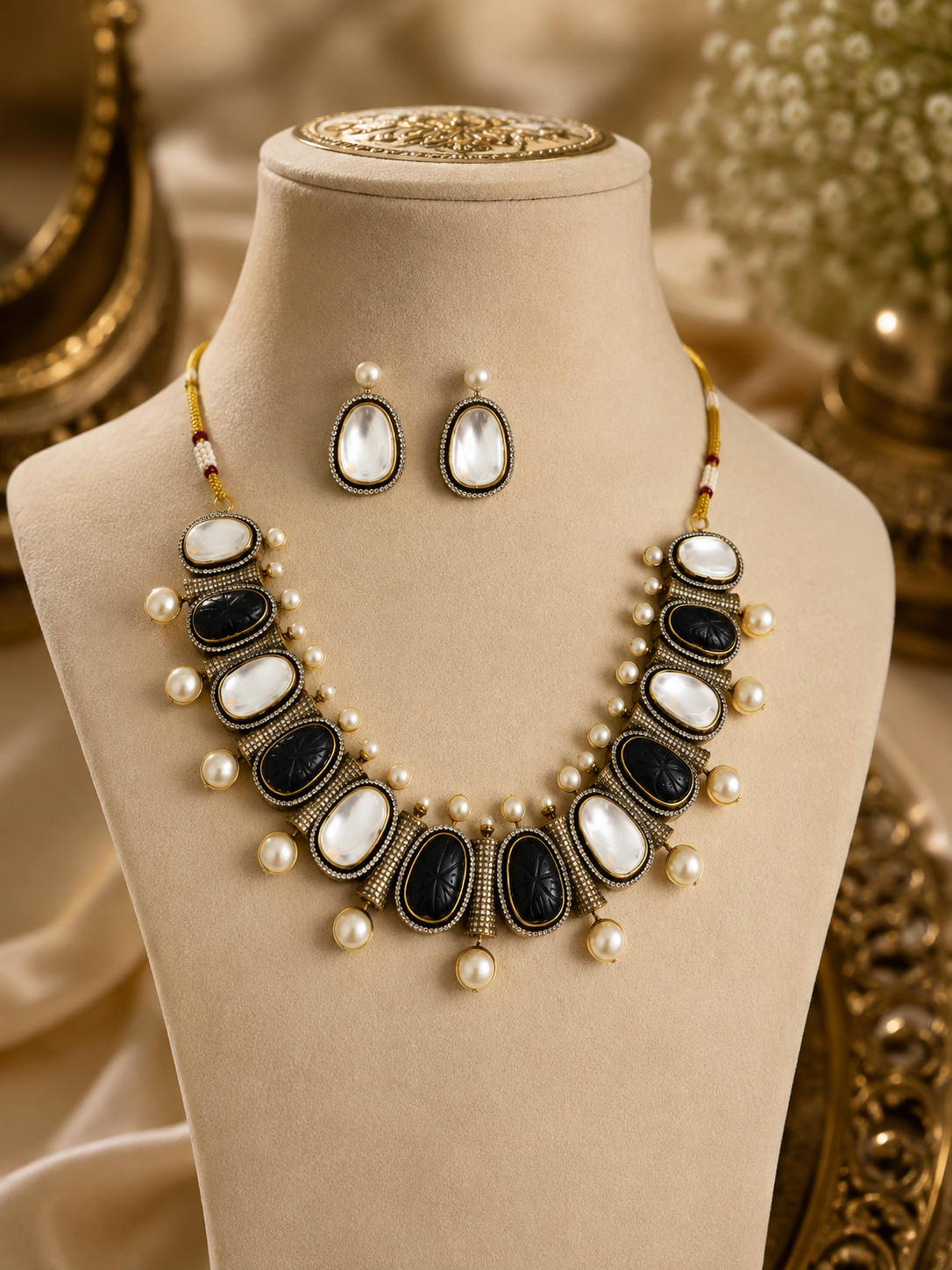 Mahira Heritage necklace set with black and white oval stones, pearl drops, stud earrings.