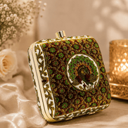 Peacock clutch bag with gold button top and dark green floral embroidery