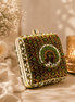 Peacock clutch bag with gold button top and dark green floral embroidery