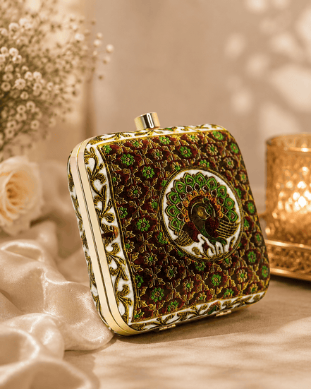 Peacock clutch bag with gold button top and dark green floral embroidery